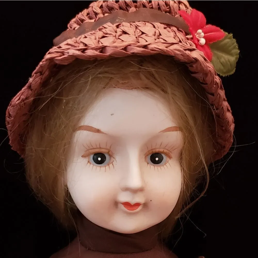Vintage Porcelain Doll with Brown Dress and Hat